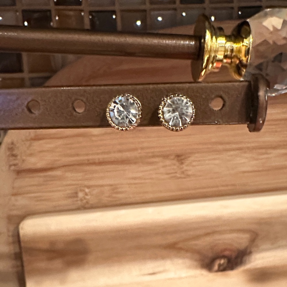 Elegant Gold Rhinestone Stud Earrings with Filigree setting.